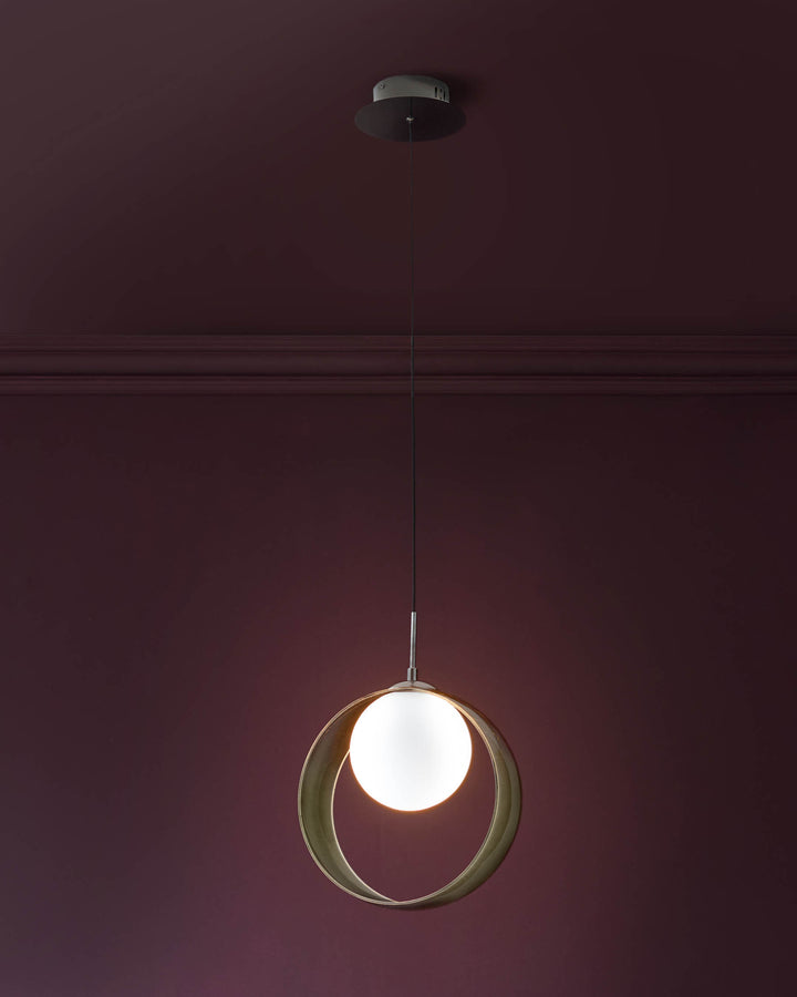 Chloe single pendant light with spherical green glass shade and illuminated white globe center, suspended by metal cord.
