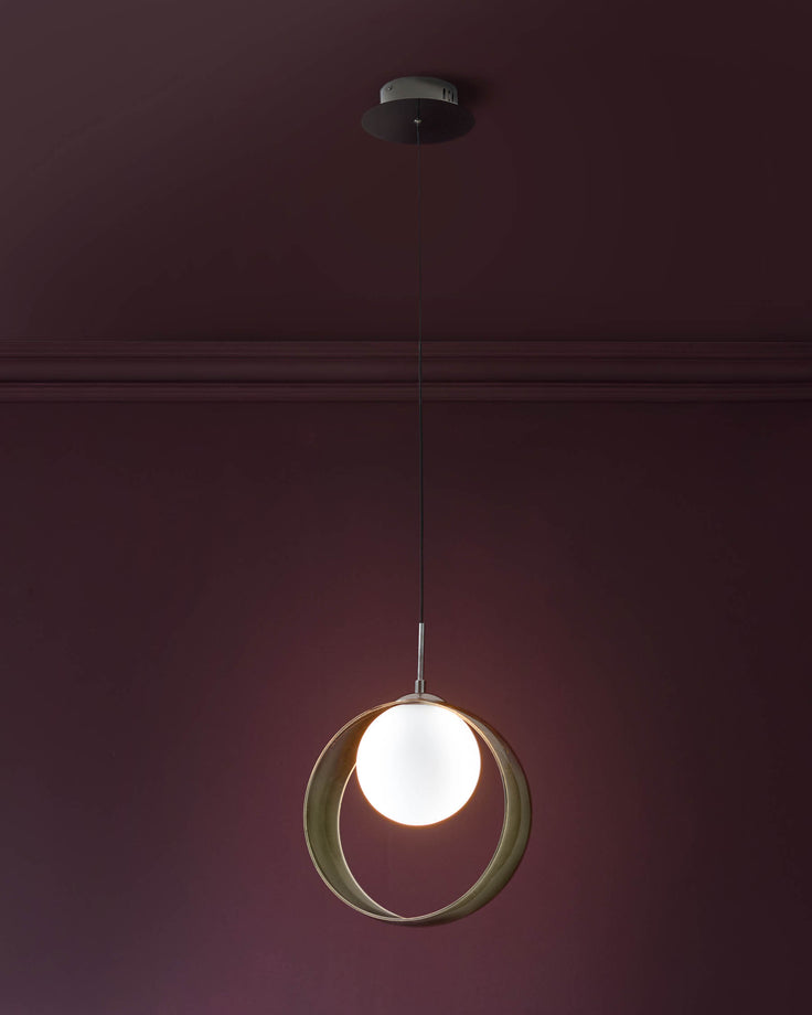 Chloe single pendant light with spherical green glass shade and illuminated white globe center, suspended by metal cord.