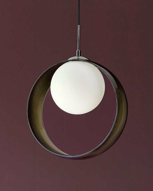 Chloe single pendant light with green-tinted glass ring and frosted white globe, hanging against burgundy background.