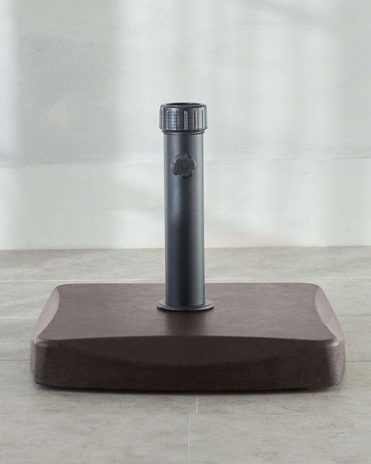 Clarissa garden parasol base in dark brown, rectangular weighted base with central black metal pole and threaded cap.