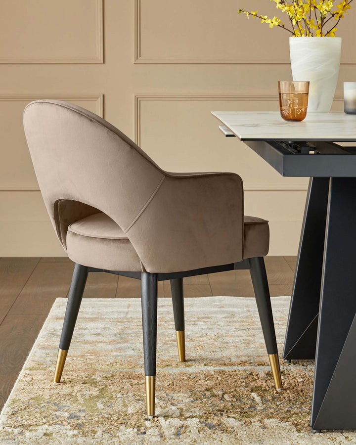 Stylish dining chair with a plush beige finish, dark wooden legs and gold tips, paired with a modern dining table.