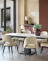 Contemporary dining set featuring a marble-top table surrounded by elegant, beige leather chairs with dark wood legs.