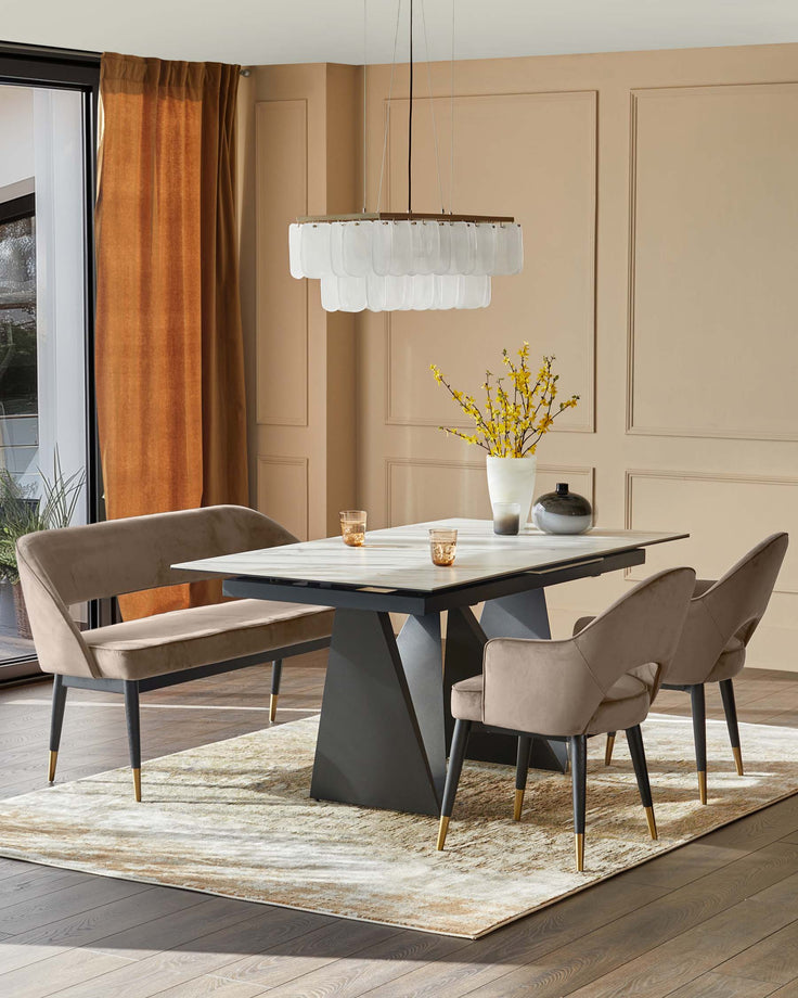 A modern dining set featuring a table, bench and chairs with a luxurious, contemporary design.