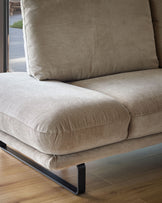 Colette right-hand corner chaise sofa in mink fabric, showing curved seat cushions and back pillow on black metal legs.