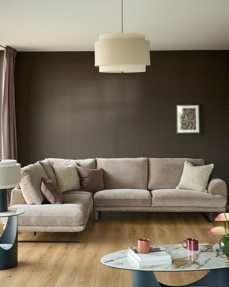 Colette left-hand corner chaise sofa in mink fabric, styled in a modern living room with neutral décor.