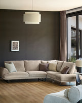Colette right-hand corner chaise sofa in mink fabric, shown in a modern living room setting with throw pillows.