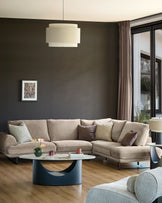 Colette right-hand corner chaise sofa in mink fabric, displayed in a modern living room with neutral décor and wooden flooring.