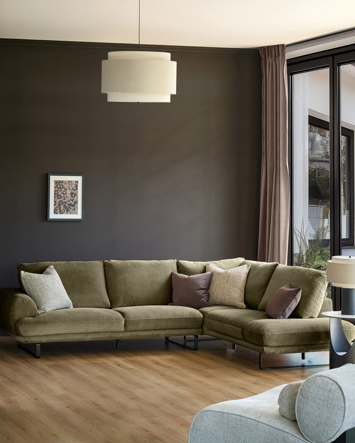 Olive green corner chaise sofa with right-hand chaise, displayed in modern living room setting with accent pillows.