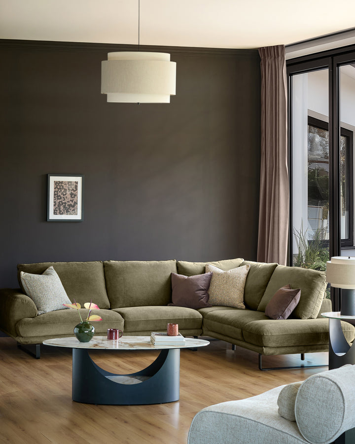 Colette right-hand corner chaise sofa in olive green fabric, displayed in a modern living room setting with complementary décor.