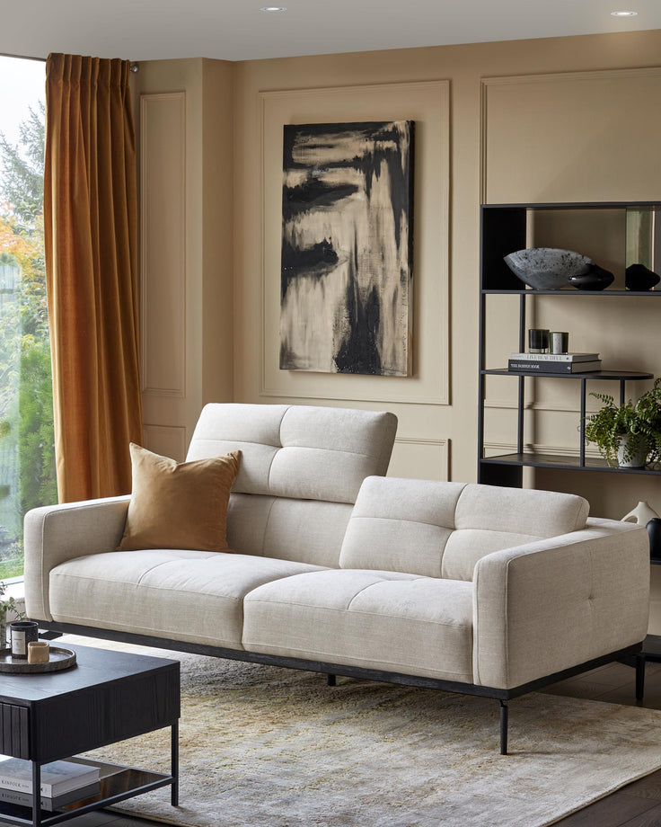 A modern living room with a comfy sofa, dark wood coffee table, and shelving unit, creating a stylish and inviting space.