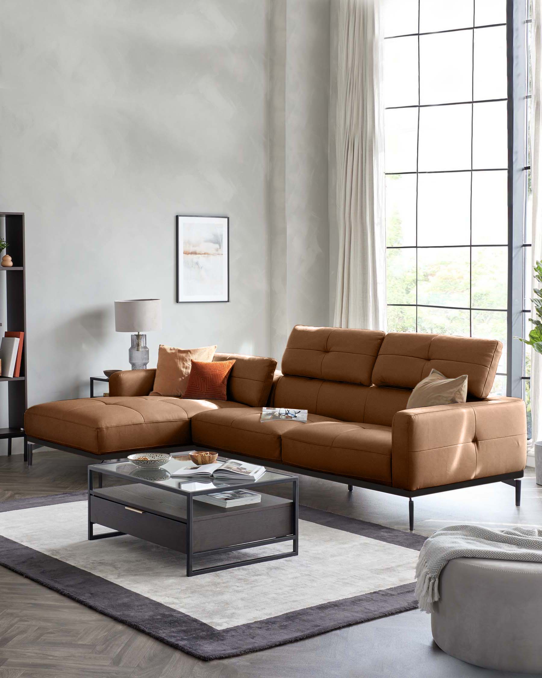 A stylish, brown, modular leather sofa with scatter cushions, a coffee table and a neutral rug in a modern living room.