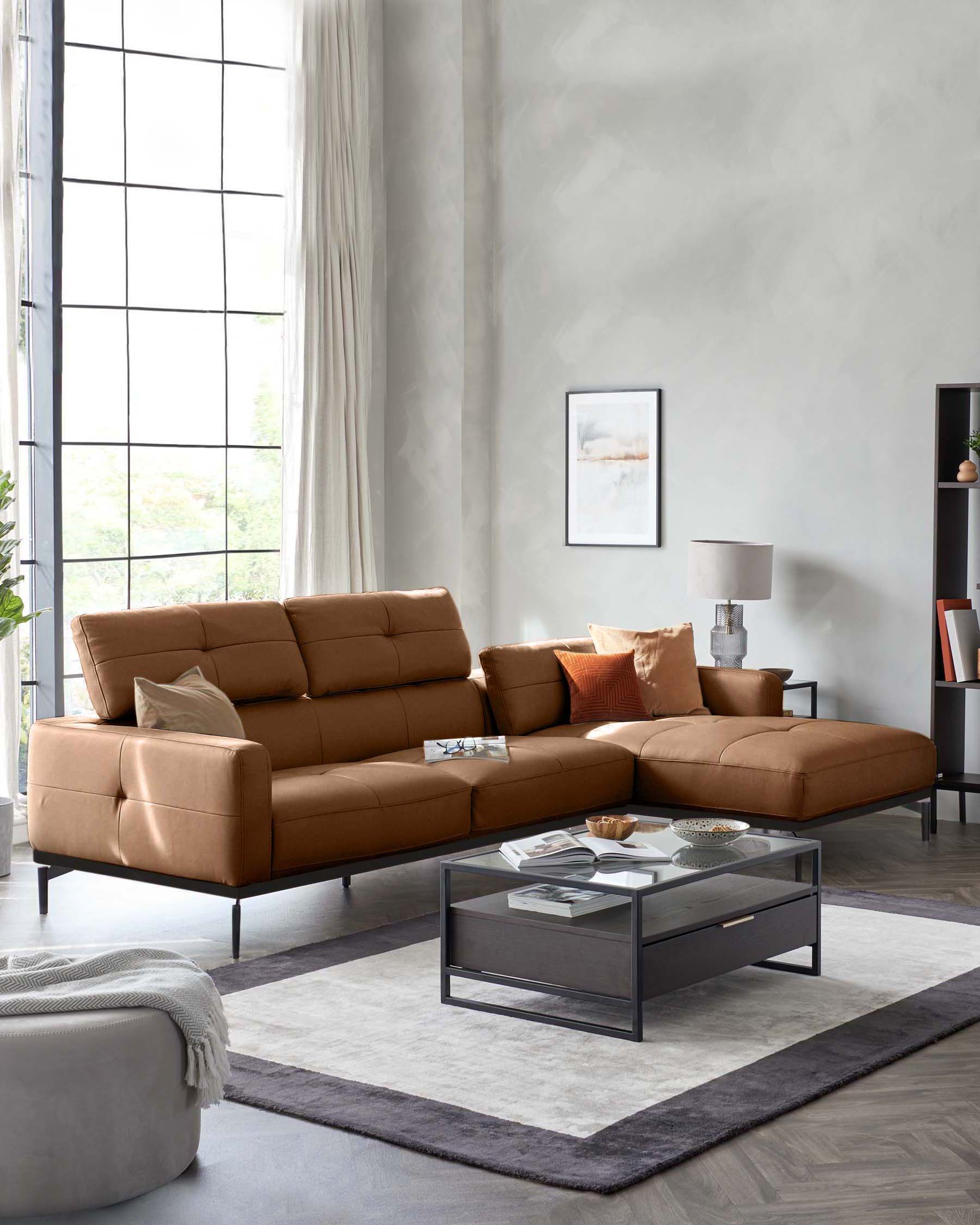 A brown leather corner sofa with a glass coffee table, a grey rug and a grey pouffe in a modern living room setting.