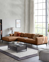 Stylish contemporary living room featuring a brown leather sectional sofa, modern coffee table and neutral coloured rug.