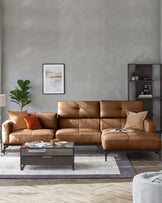 A modern, tan leather sofa with a chaise lounge, complemented by a glass-topped coffee table and stylish shelving unit.