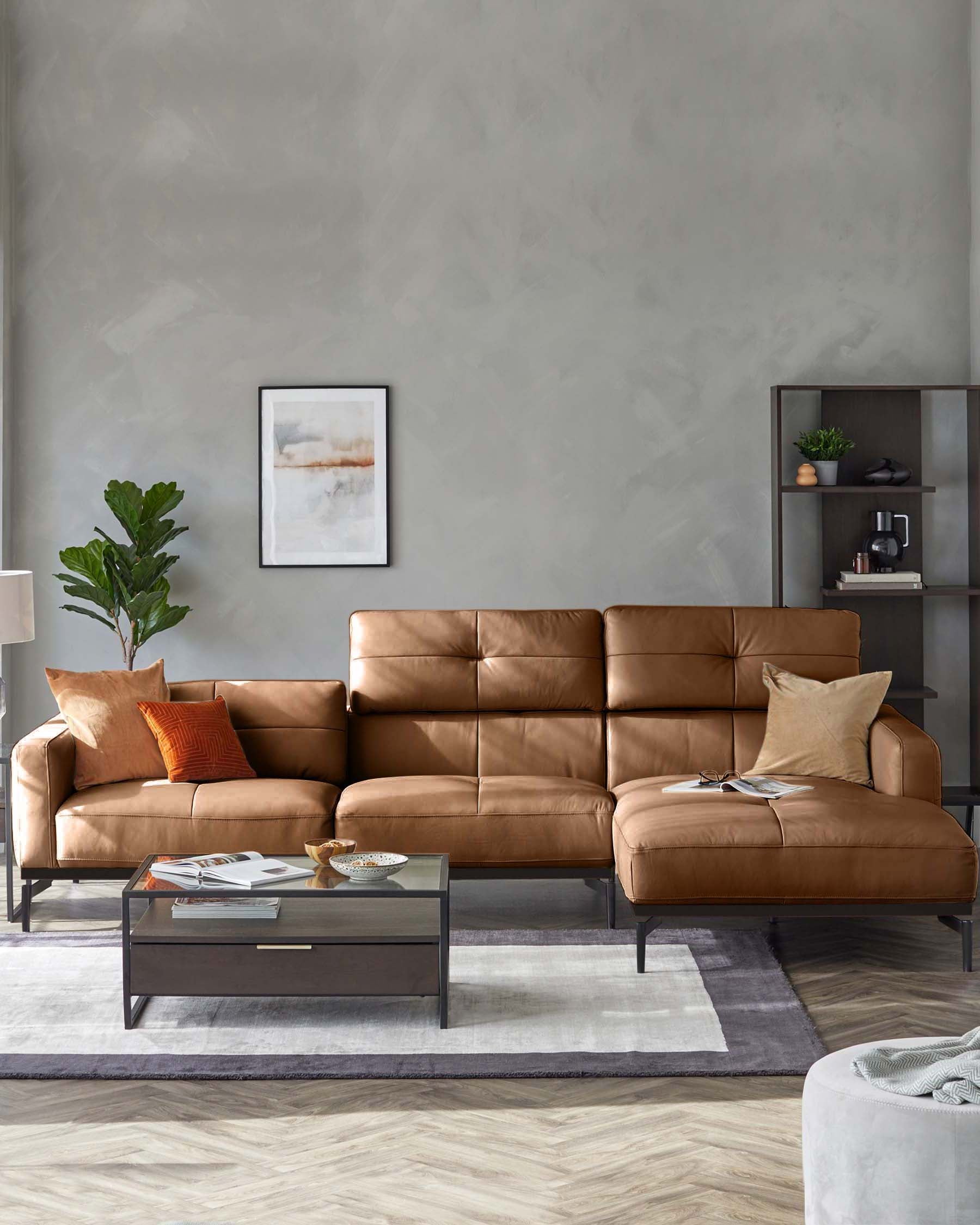 A modern, tan leather sofa with a chaise lounge, complemented by a glass-topped coffee table and stylish shelving unit.