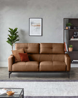 A stylish brown leather sofa with dark metal legs, complemented by cushions and a modern shelving unit.