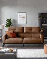 A tan leather sofa with pillows, a dark wood bookcase and coffee table create an inviting living space.