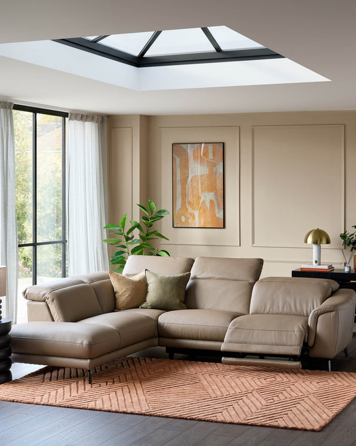 Connor left-hand corner chaise sofa in natural leather, shown in a modern living room setting with reclining features.