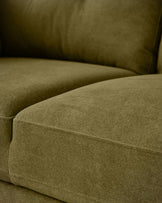 Delilah 3-seater sofa in pistachio green fabric, close-up detail of cushioned seat and backrest.