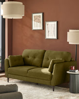 Pistachio green 3-seater sofa with tufted back and arms, tapered wooden legs, displayed in a styled living room setting.