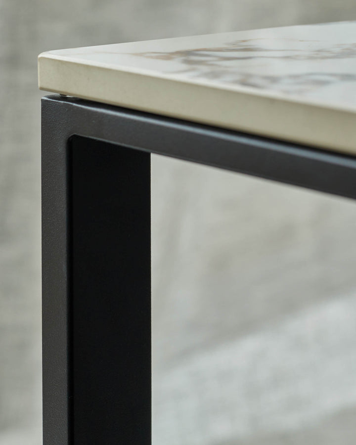 Modern table with a marble top and black metal frame. Minimalist design suitable for any contemporary living space.