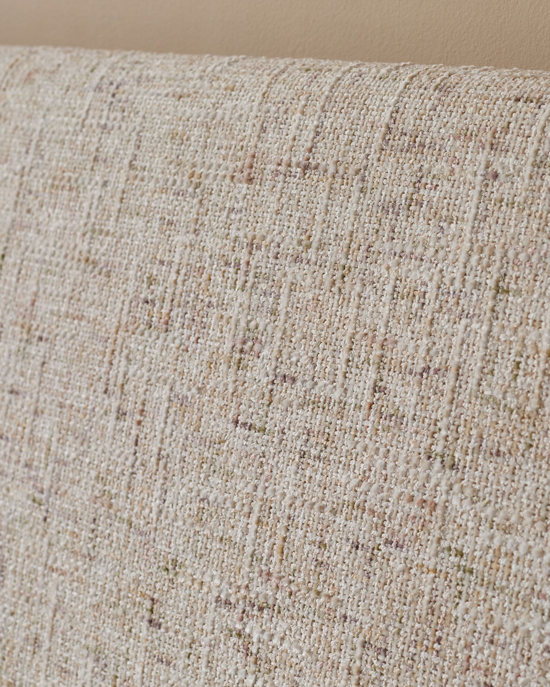 Close-up of natural beige fabric texture on Deven king-size ottoman bed, showing woven weave detail.