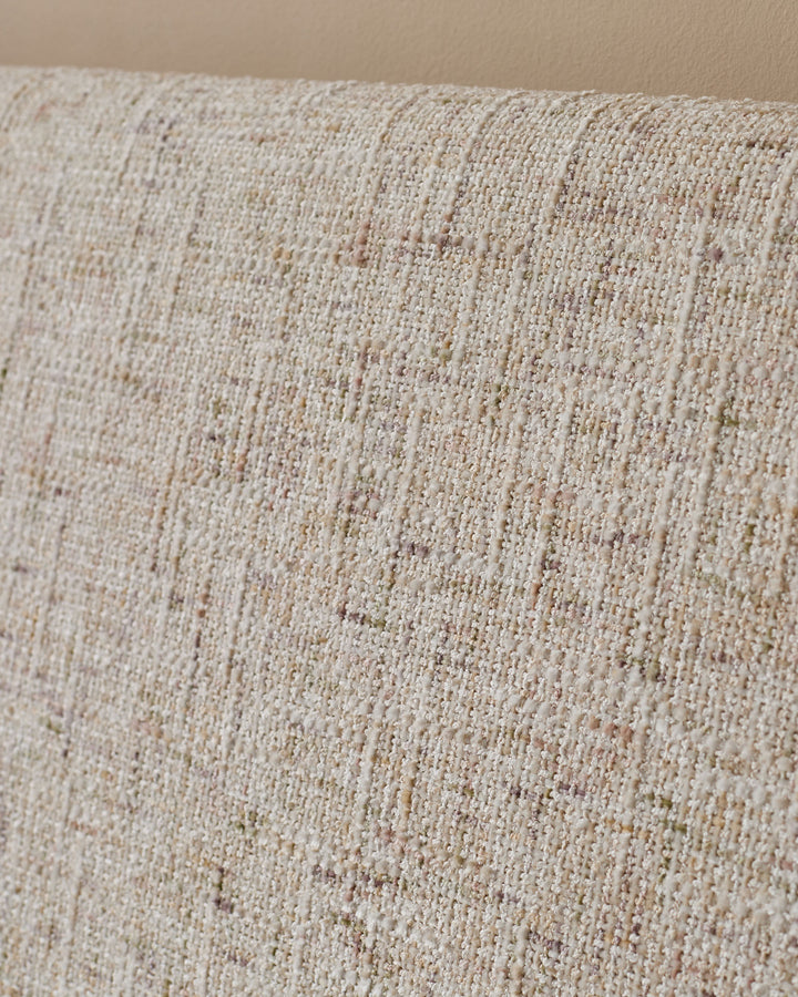 Close-up of natural beige fabric texture on Deven king-size ottoman bed, showing woven weave detail.