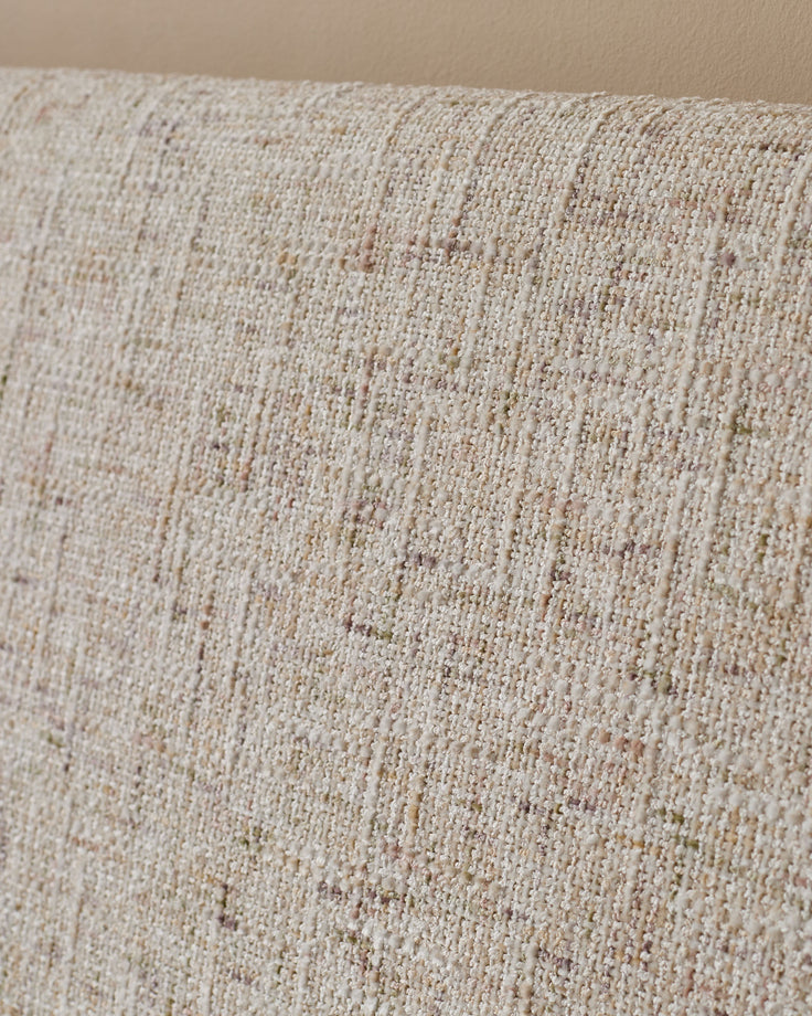 Close-up of natural beige fabric texture on Deven king-size ottoman bed, showing woven weave detail.