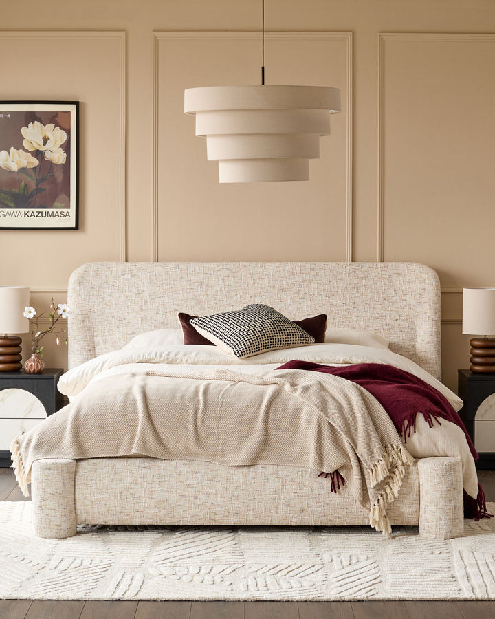 Deven King-Size Ottoman Bed in natural fabric with rounded headboard, displayed in a styled bedroom setting with neutral décor.