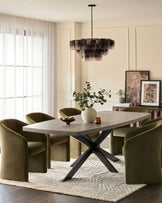 Donato dark grey dining table with black X-frame base, seated with olive green chairs in a bright dining room setting.