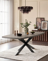Donato Garden 10-seater dining table with dark grey top and black X-frame base in modern dining room setting.