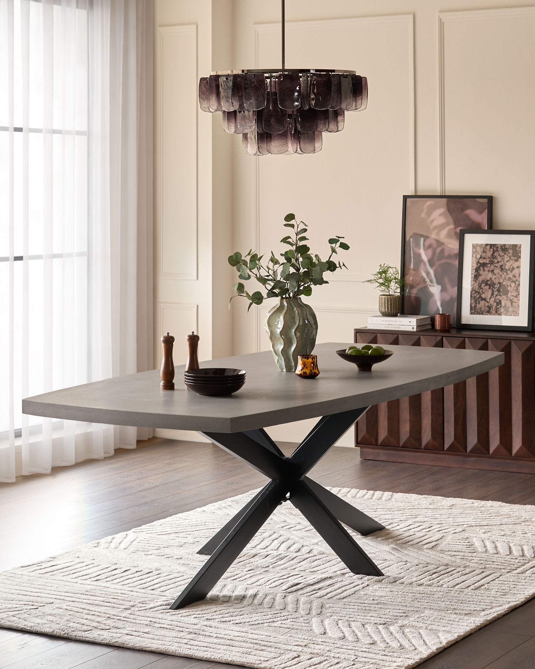Donato Garden 10-seater dining table with dark grey top and black X-frame base in modern dining room setting.