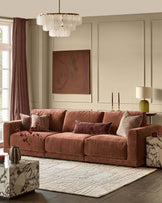 Eden 3-seater sofa in apricot fabric, displayed in a styled living room with decorative pillows and neutral decor.