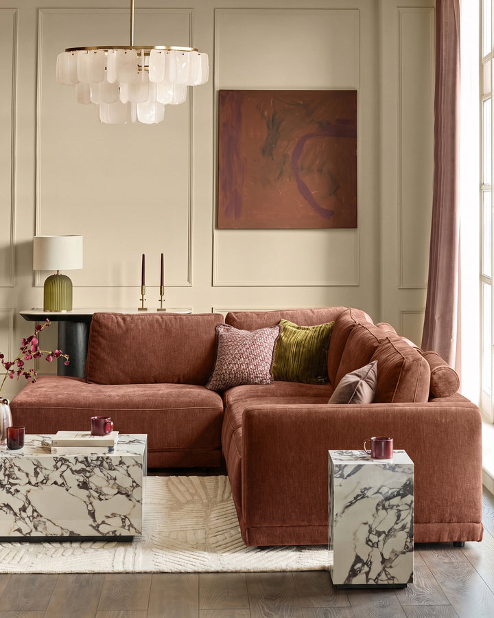 Eden left large chaise sofa in apricot fabric, L-shaped configuration, displayed in styled living room setting.