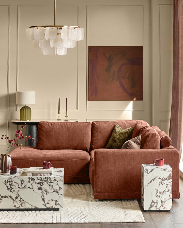 Eden left small chaise sofa in apricot fabric, displayed in a modern living room setting with decorative pillows.