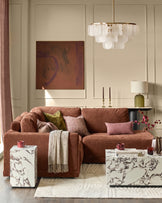 Eden right small chaise sofa in apricot fabric, displayed in a styled living room setting with coordinating pillows and throws.