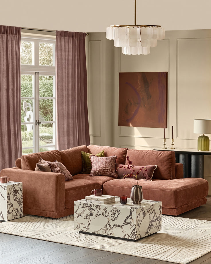 Eden right small chaise sofa in apricot fabric, displayed in a styled living room setting with coordinating décor.