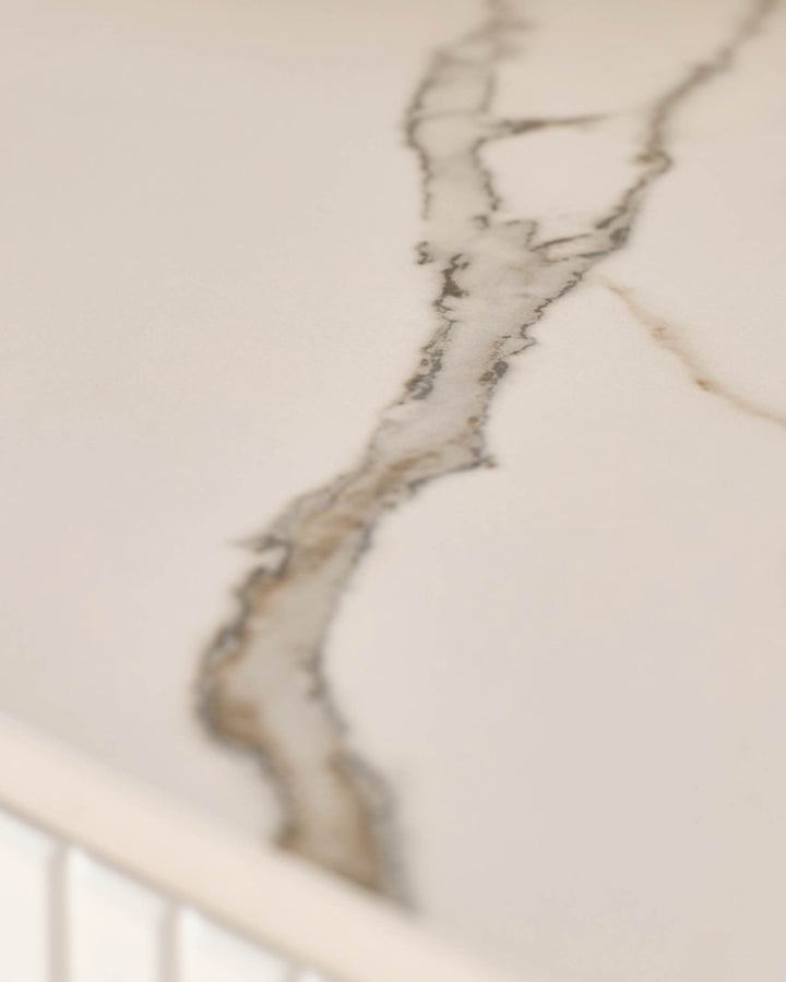 Edie Large Sideboard in natural ceramic with veined surface detail, close-up of handle.