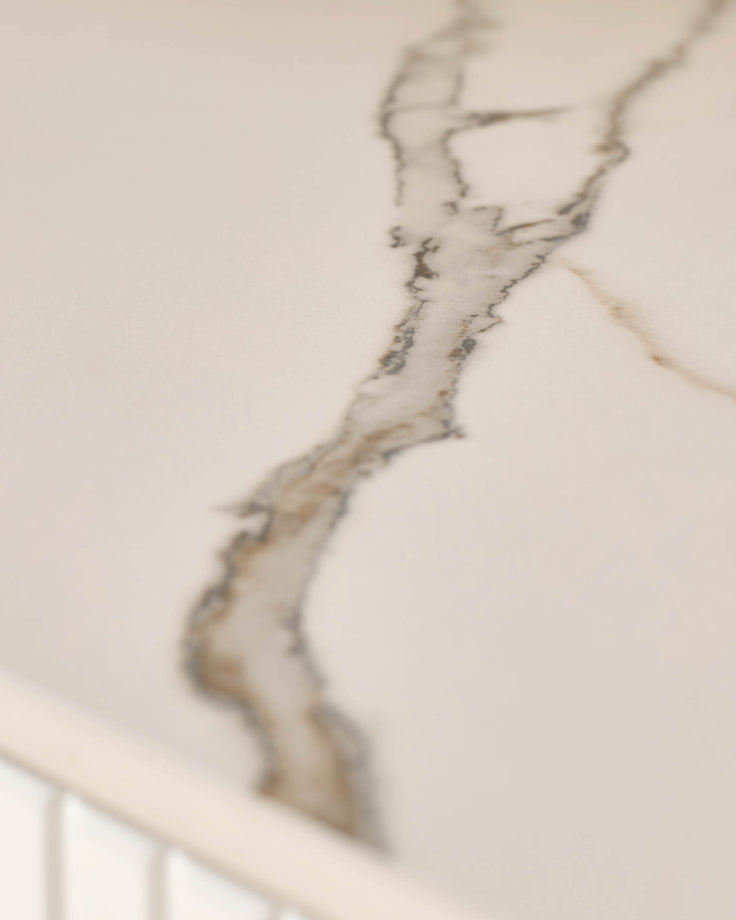 Edie Large Sideboard in natural ceramic with veined surface detail, close-up of handle.