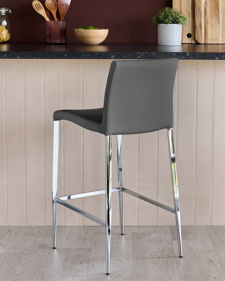 Grey bar stool with chrome legs, in a modern kitchen setting. Ideal seating for a kitchen island or bar area.