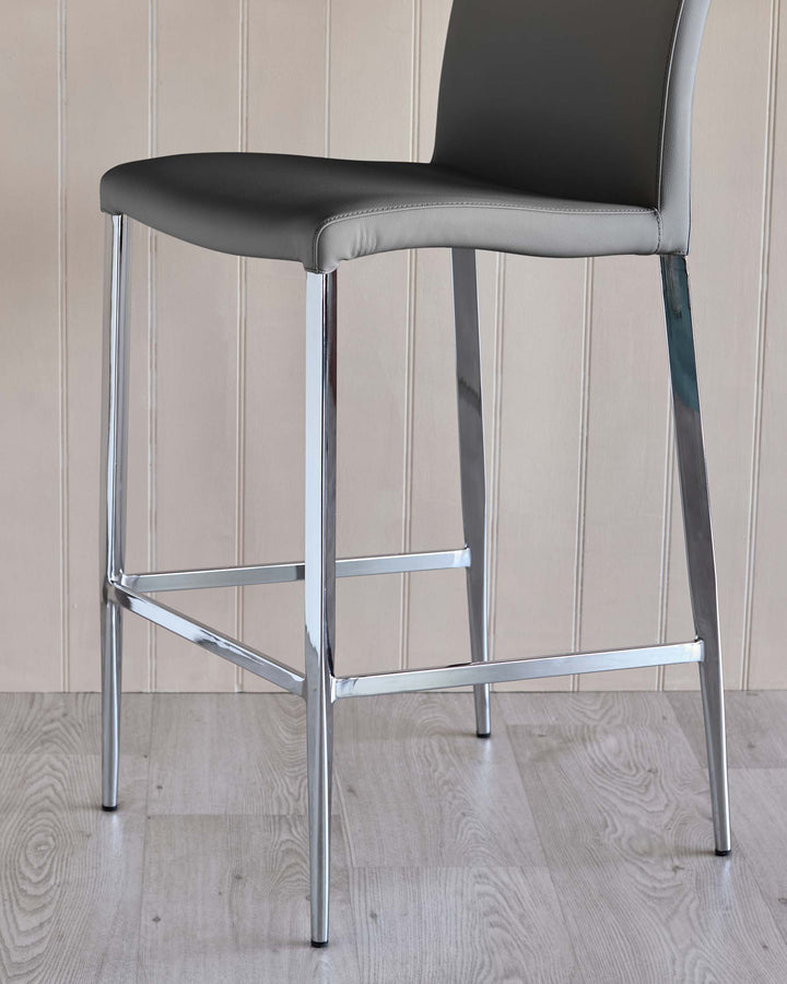 A modern grey bar stool with chrome legs. Contemporary and stylish design.