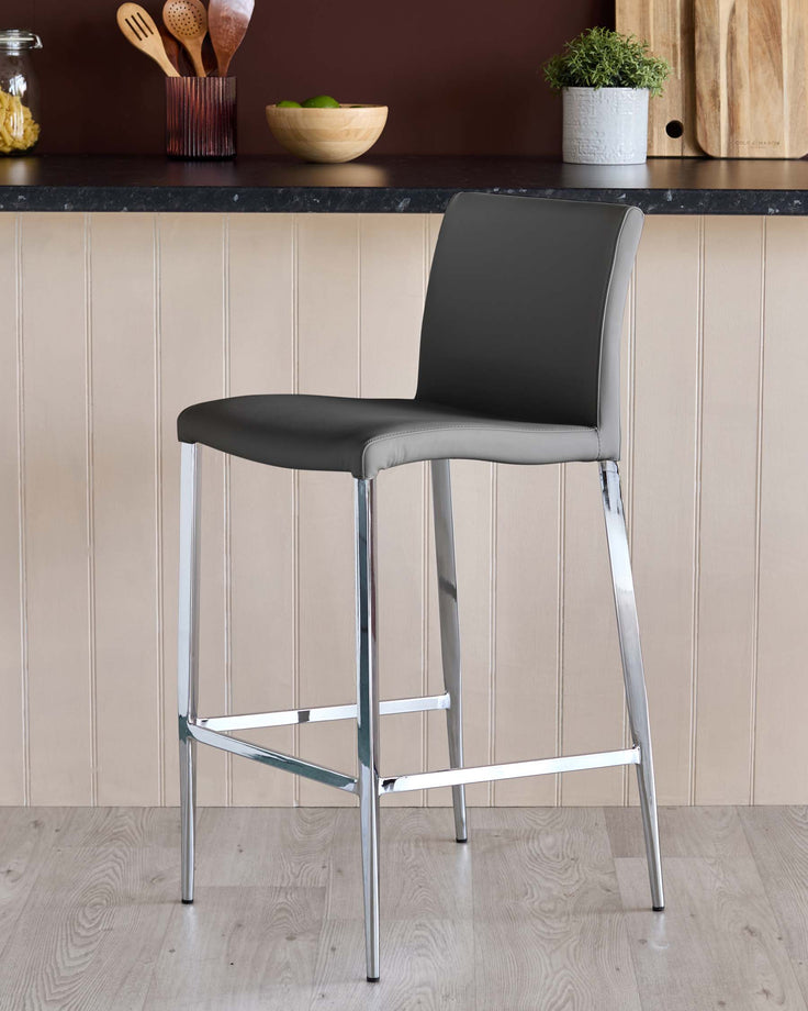Contemporary bar stool with grey seat and back, and sleek chrome legs, ideal for modern kitchen counters.