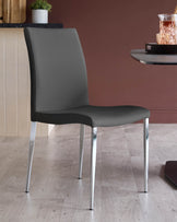 A stylish grey dining chair with sleek chrome legs adds a modern touch to any dining space.