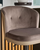 Elodie gas lift bar stool with mocha velvet backrest, natural faux leather seat, and wood base, angled side view.