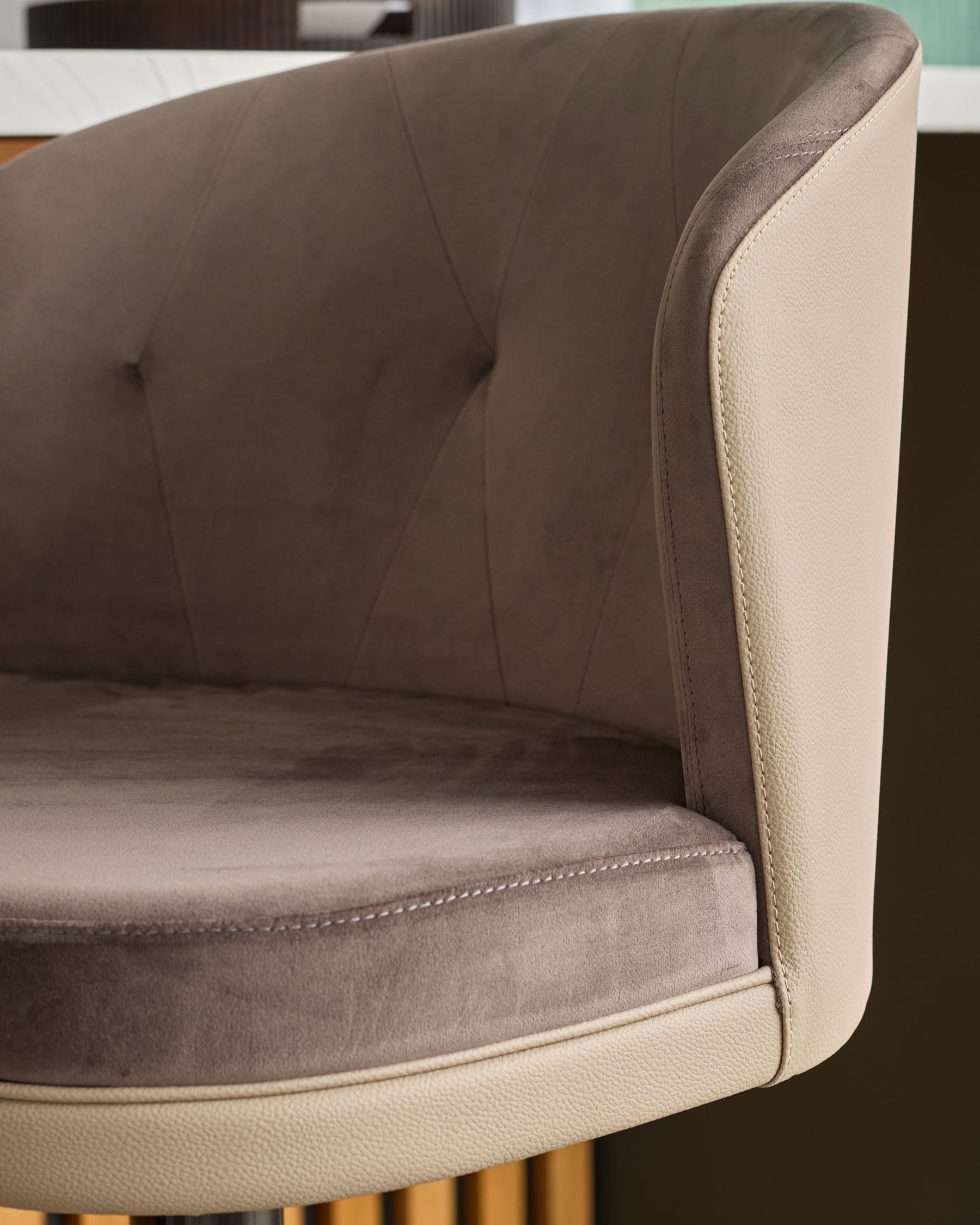 Elodie gas lift bar stool with mocha velvet and natural faux leather, showing curved backrest and seat detail from side angle.