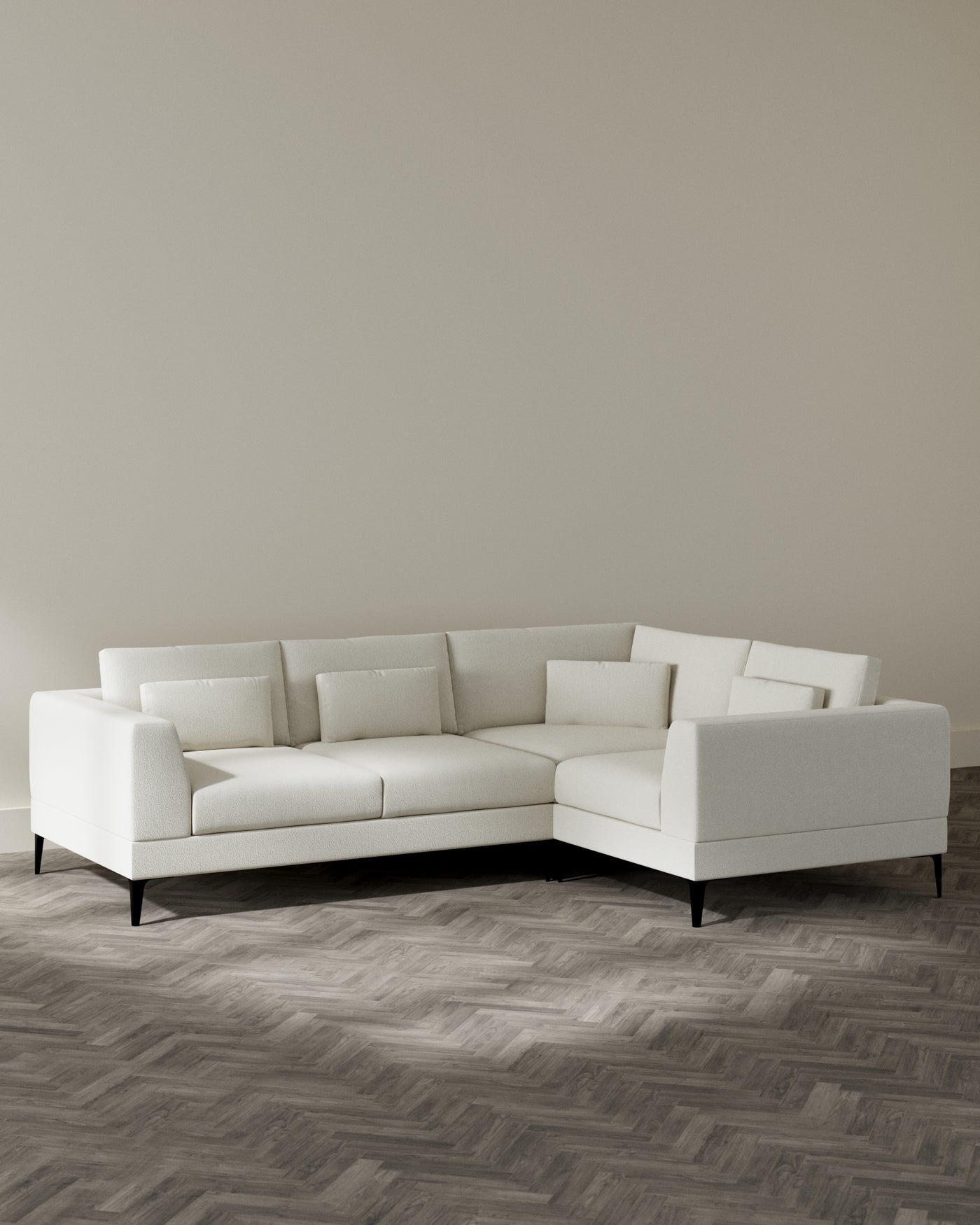 Modern L-shaped sectional sofa with a minimalist design, featuring a clean ivory upholstery and sleek black tapered legs. Perfect for contemporary living spaces.