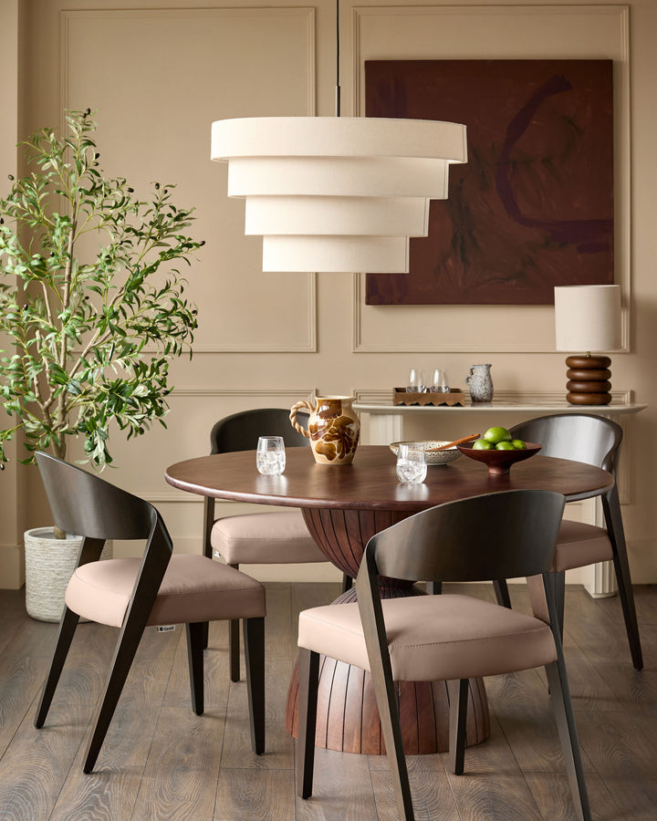 Enzo dining chair in mocha leather, shown at round dining table in modern dining room setting.