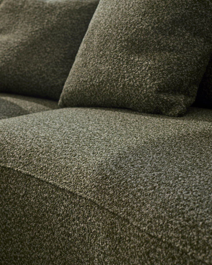 Close-up of dark green fabric texture on Eris left-hand corner chaise sofa, showing upholstered seat and cushions.