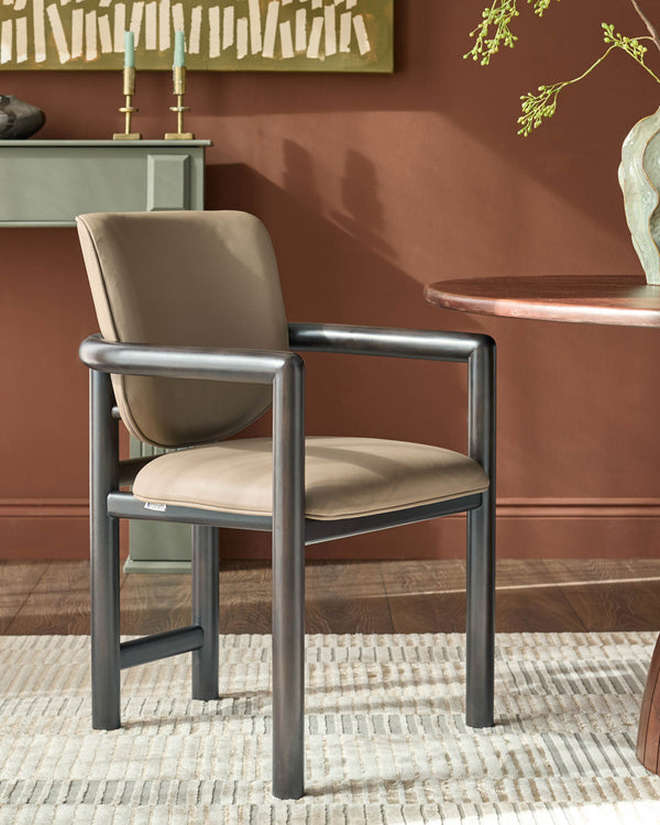 Esme dining chair in mocha leather with dark metal frame, shown in warm terracotta room setting.
