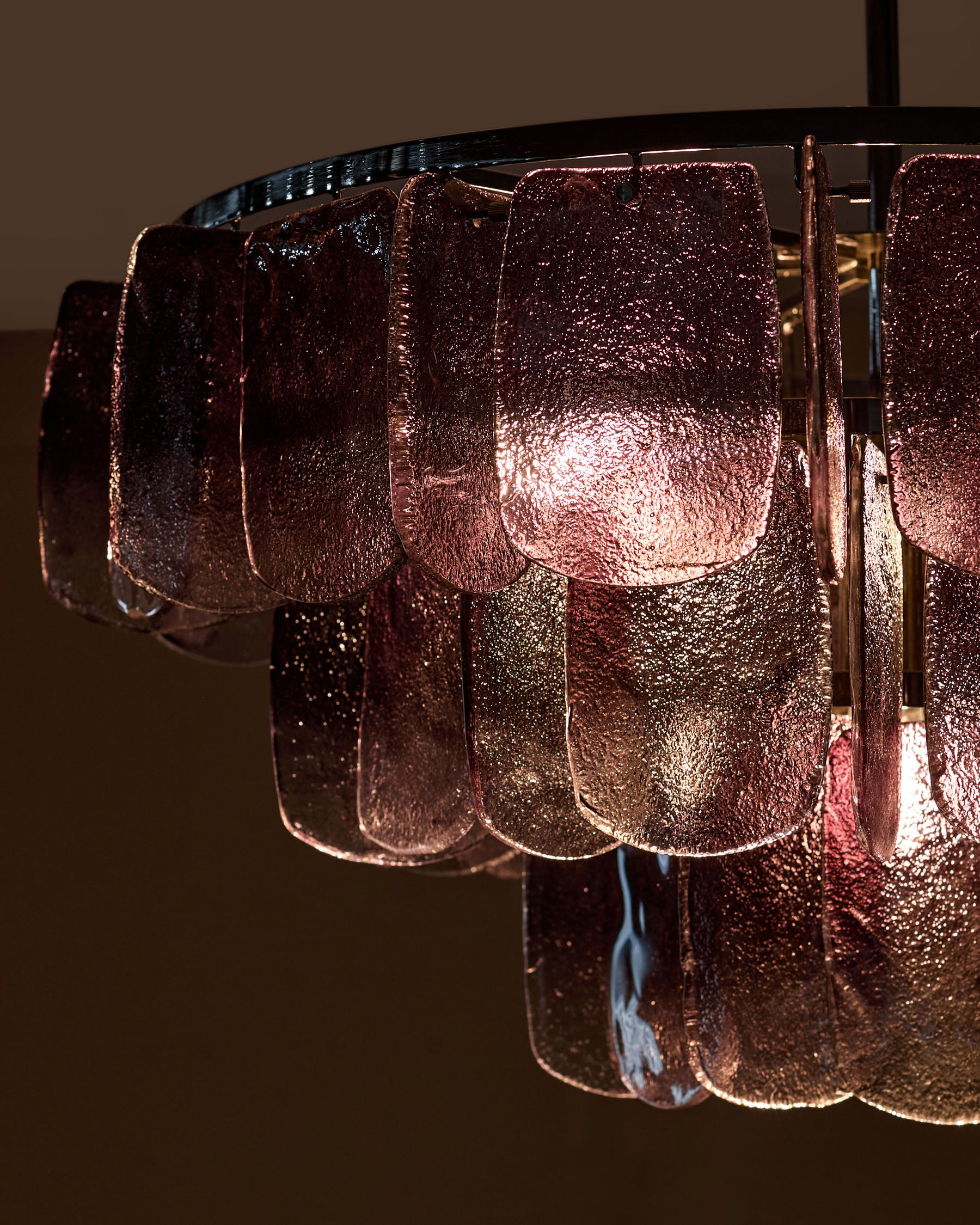 Estelle chandelier with smoked ombre glass panels, close-up detail of textured glass shades and metallic finish.